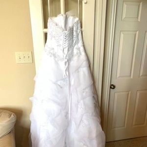 Beautiful white beaded corset style wedding gown.